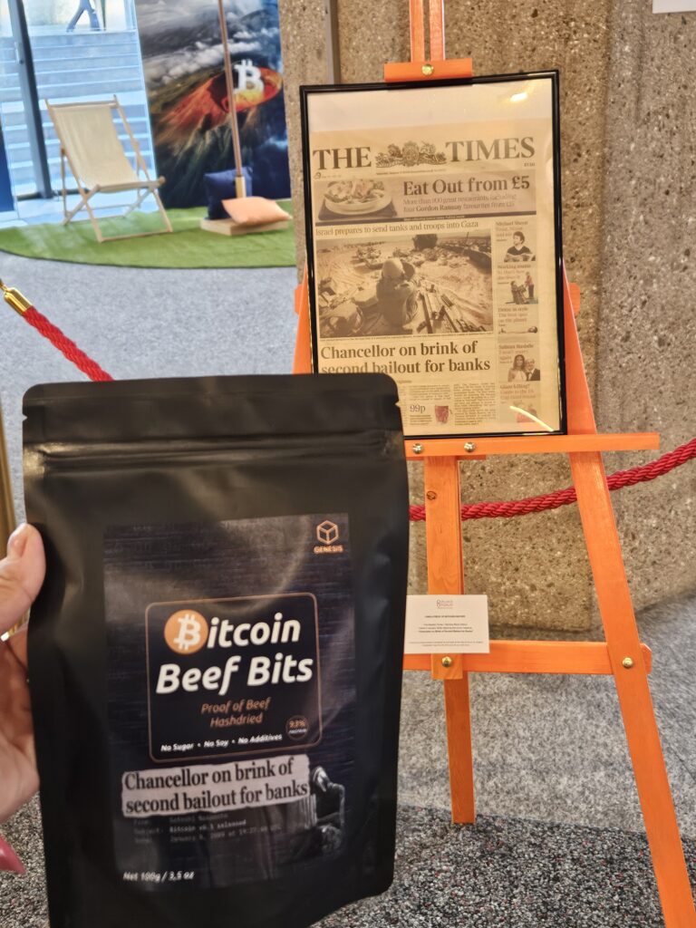 Bitcoin Beef Bits bag in front of the original newspaper with the Chancelor on the brink of second bailout for banks.